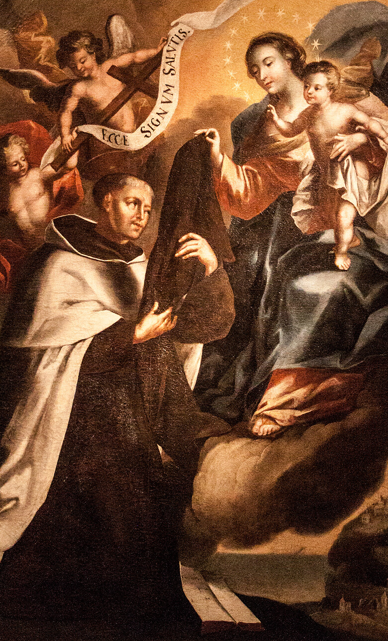 Nossa Senhora do Carmo com o Menino Jesus entregando o escapulário marrom a São Simão Stock, um anjo segurando um estandarte com “Ecce signum salutis”