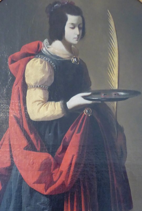 Santa Luzia, jovem de cabelos escuros, com manto vermelho e mangas amarelas, de olhos baixos, segurando um prato e a palma do martírio, pintura de Zurbarán