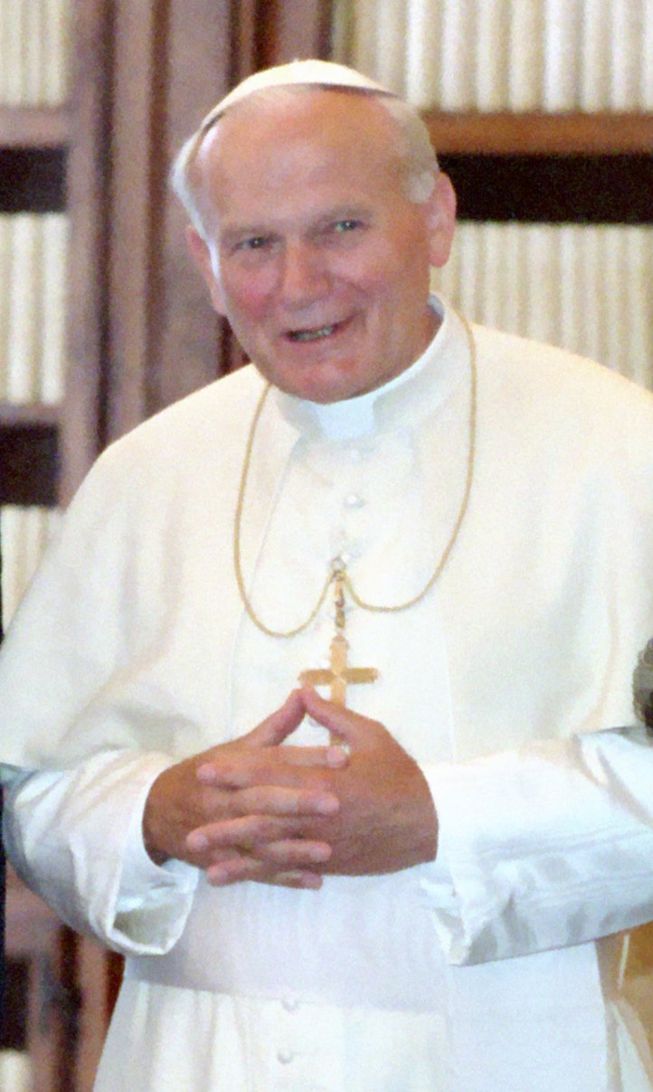 Pope John Paul II smiling, photographed in 1987 in the Vatican Library