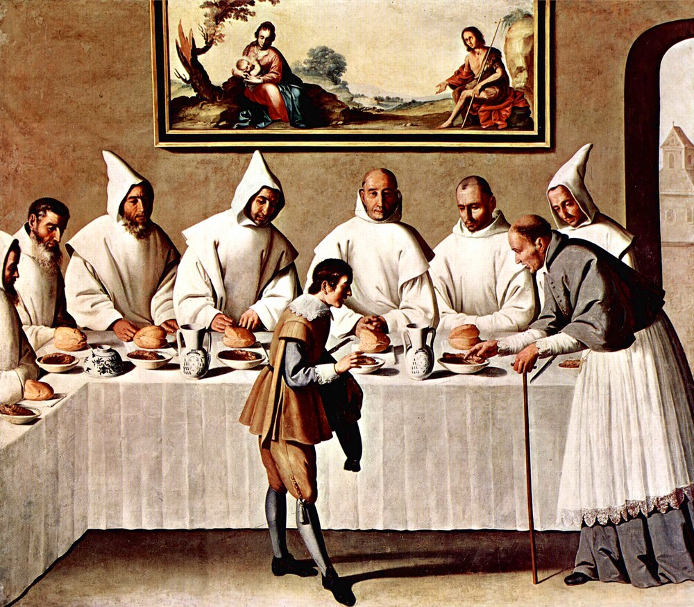 Carthusian monks in white habits at the refectory table, served by a young man
